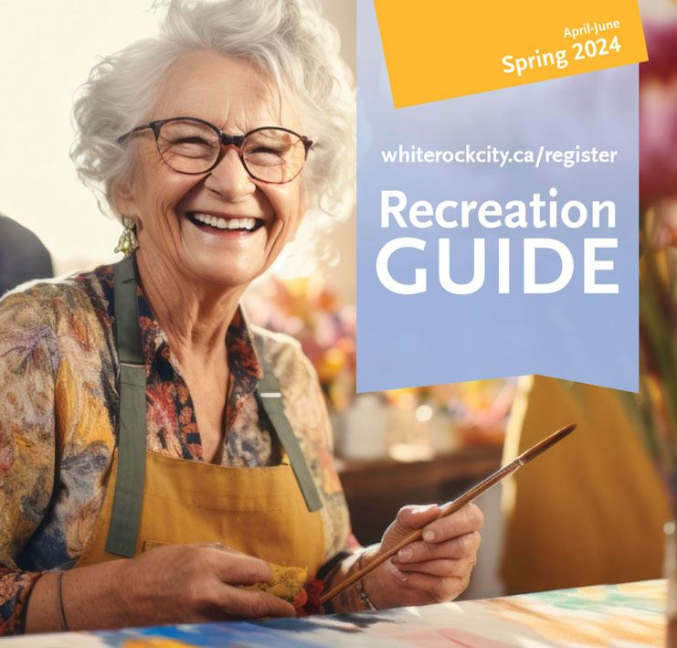 senior woman smiling and holding paint brush, spring 2024 recreation guide 