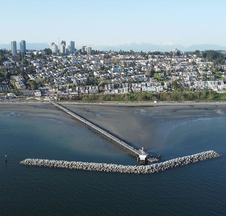 Aerial view of the White Rock Pier and beach waterfront.