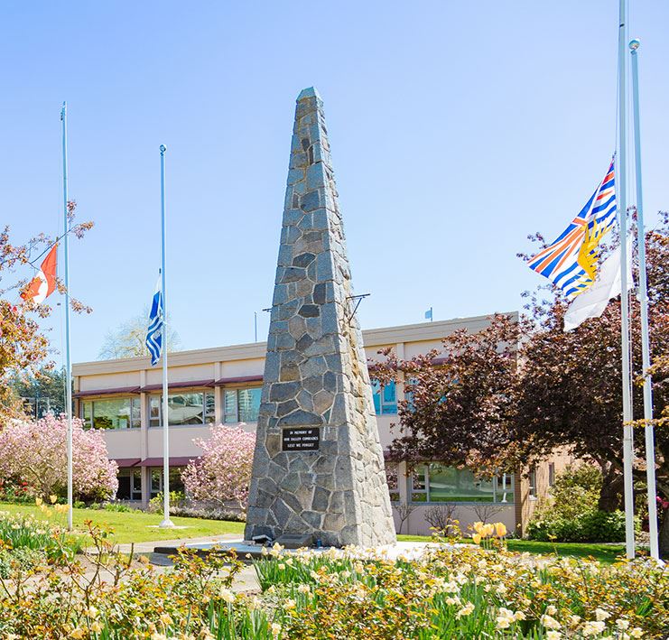 flags at half mast in front of White Rock City Hall.