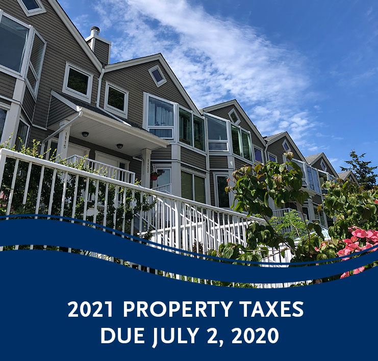 townhouses with blue skies in White Rock - Property Taxes due July 2