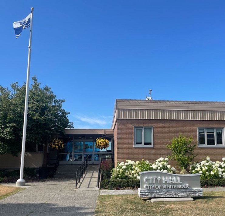 White Rock City Hall, building with blue sky and flagpole
