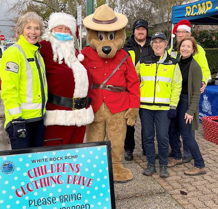 White Rock RCMP volunteers with Santa and Safety Bear