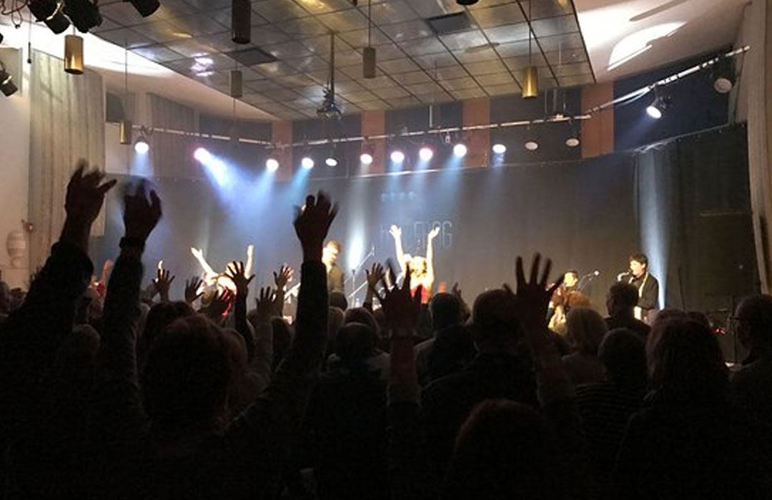 crowd watching band on stage