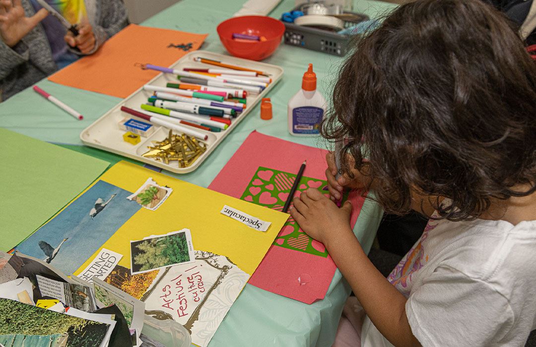 kid painting with crafts