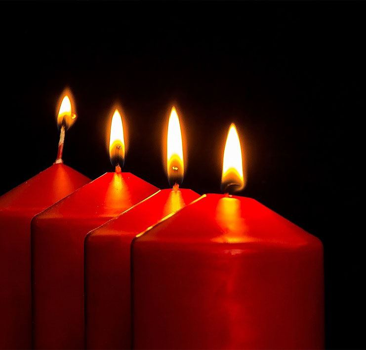 three red candles burning, lit